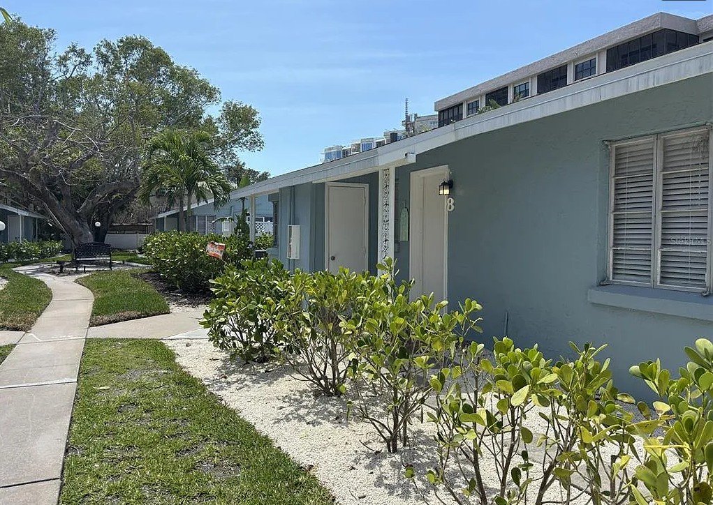Exterior view of Pelican Gardens Unit 8 and community walkway